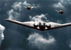 美空军现役的诺格B-2A“幽灵”隐身轰炸机与F-117隐身攻击机编队飞行图。