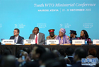 12月16日，在肯尼亞內羅畢，世貿組織總干事阿澤維多、肯尼亞總統烏肯雅塔、利比里亞總統埃倫·約翰遜-瑟利夫、肯尼亞外交與國際貿易部長阿明娜·穆罕默德（前排從左至右）出席世界貿易組織第十屆部長級會議。世界貿易組織第十屆部長級會議16日在肯尼亞首都內羅畢通過協議，正式批準利比里亞加入世貿組織。